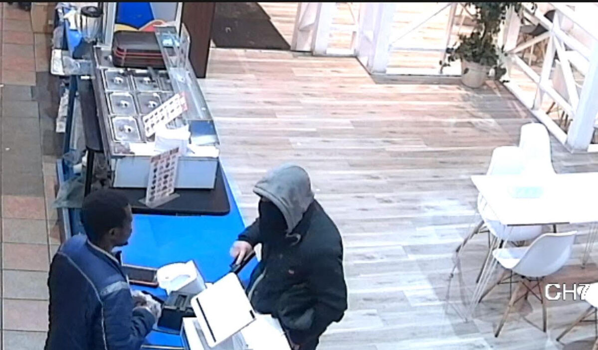The man entered Crown Fried Chicken, displayed a black handgun and demanded money before fleeing.