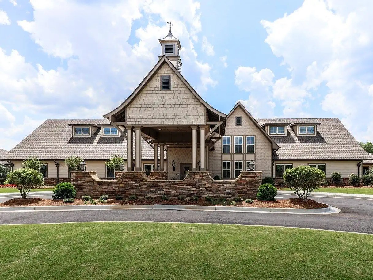 Commercial buildout in Dallas, Georgia. A senior memory care center, finished with a grand covered entrance and stone accents to create a welcoming, residential feel.