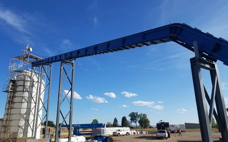 Enclosed drag chain conveyor viewed from the ground