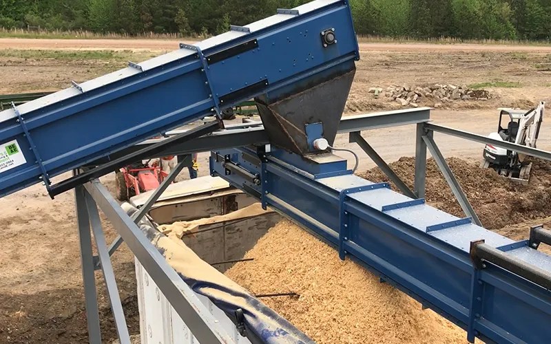 Biomass trailer loading station