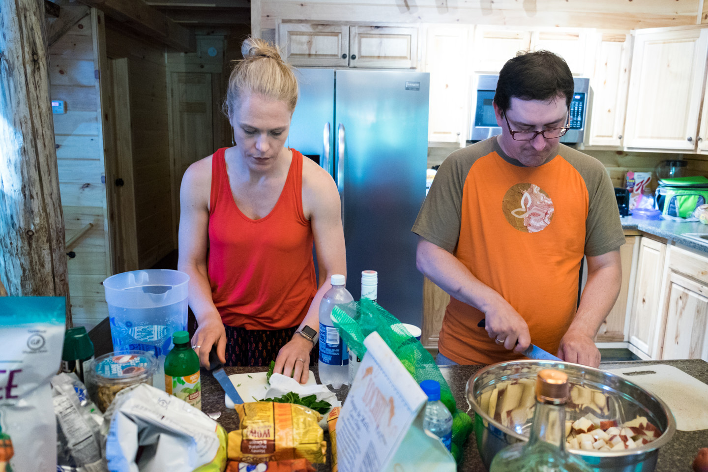 Suzanne makes mojitos while Dan takes side dish duty this weekend