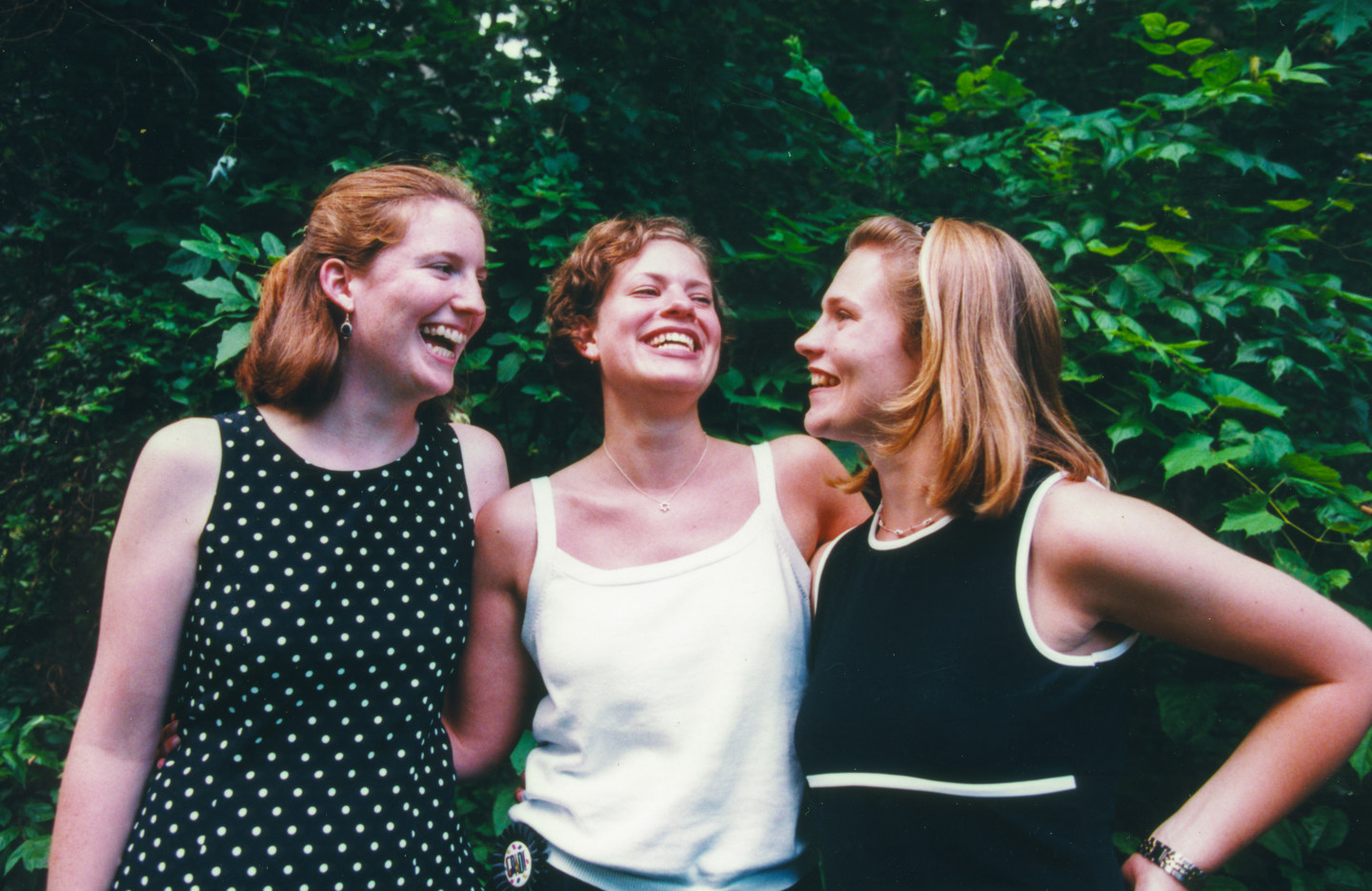 A shot of the three of us behind our house senior year on graduation day