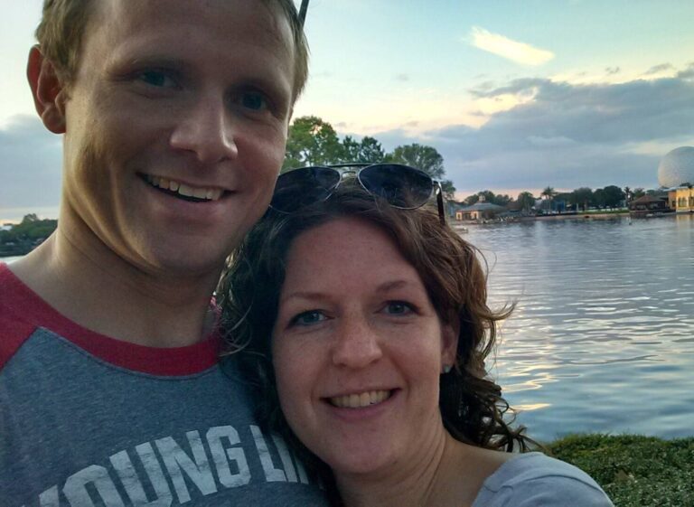 Husband & wife, smiling