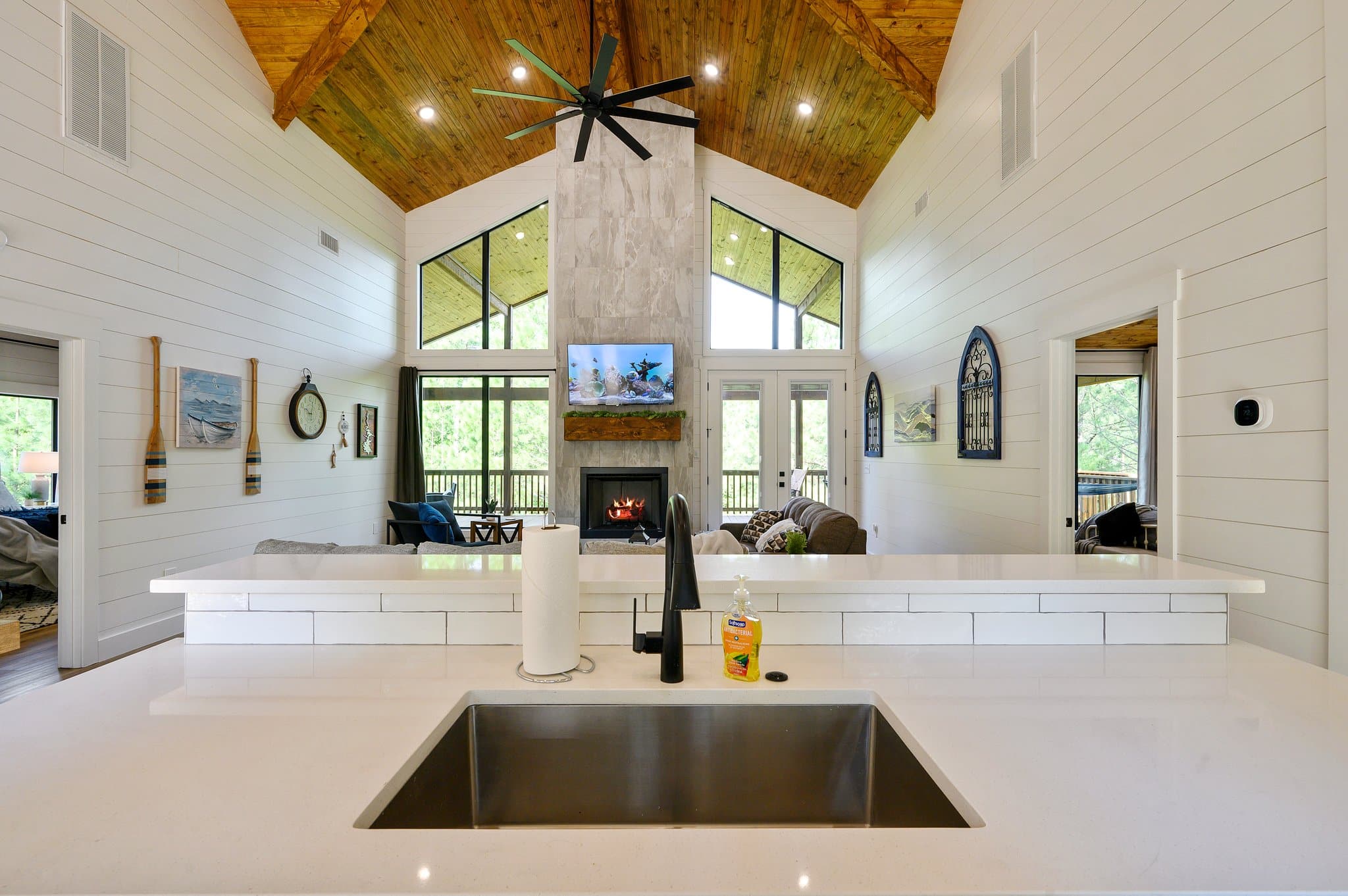 Kitchen island overlooking the open living room and fireplace