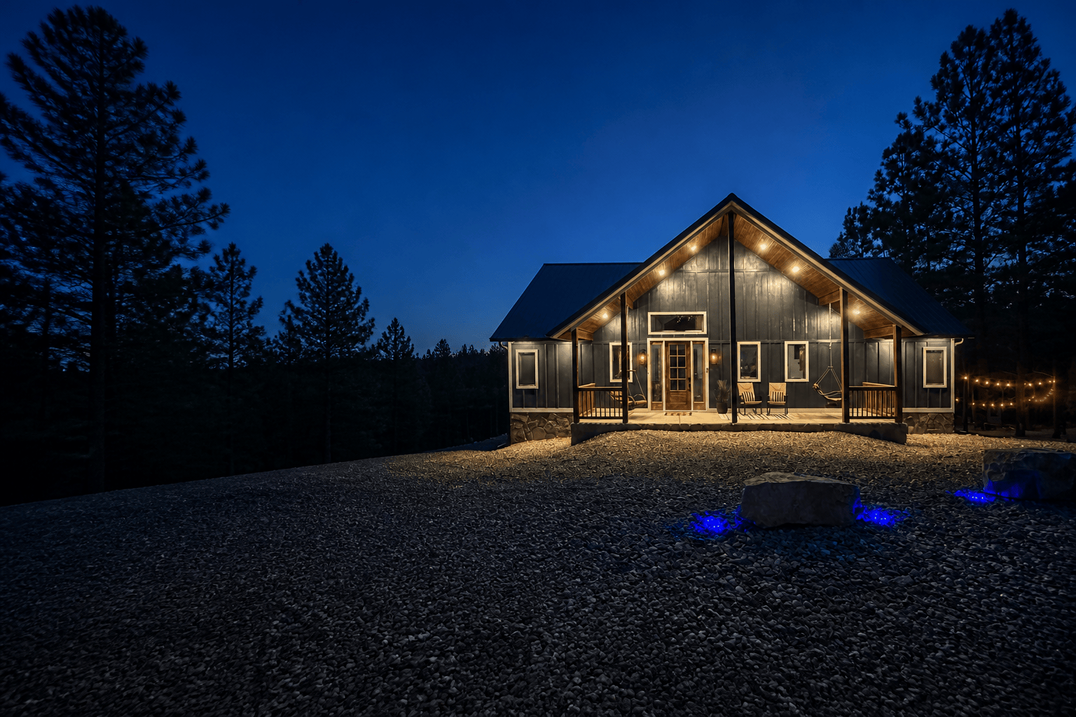 Beds, Boating & Beyond cabin illuminated at dusk among the pines in Hochatown, Oklahoma