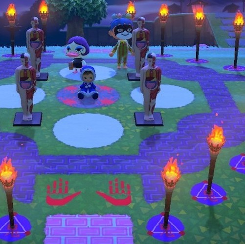 Animal Crossing New Horizons island design summoning circle with human anatomy models, dolls and torches.