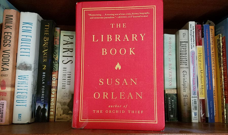 The Library Book by Susan Orlean displayed on bookshelf