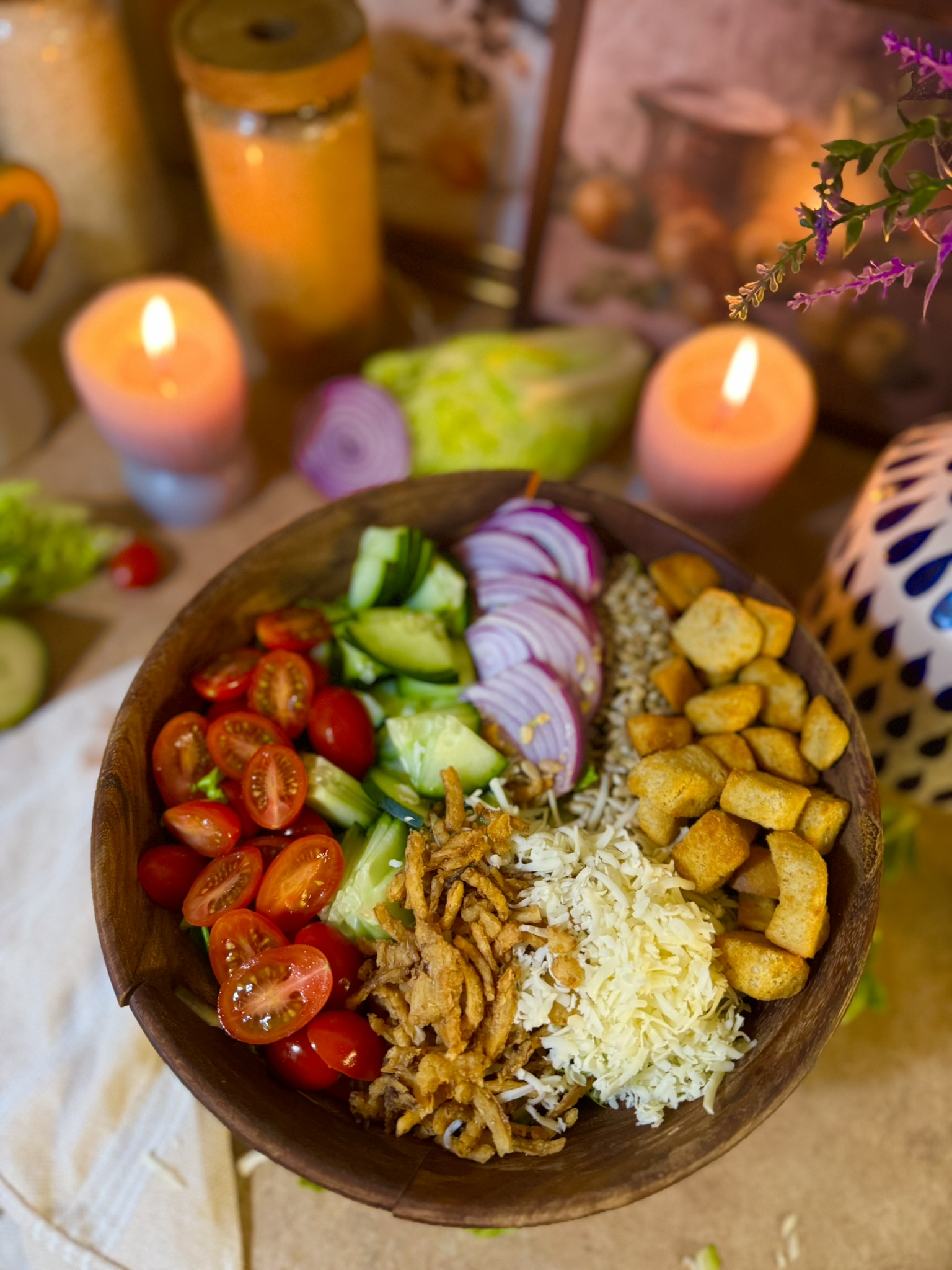 garden salad topped with fresh tomatoes, cucumbers, and red onions