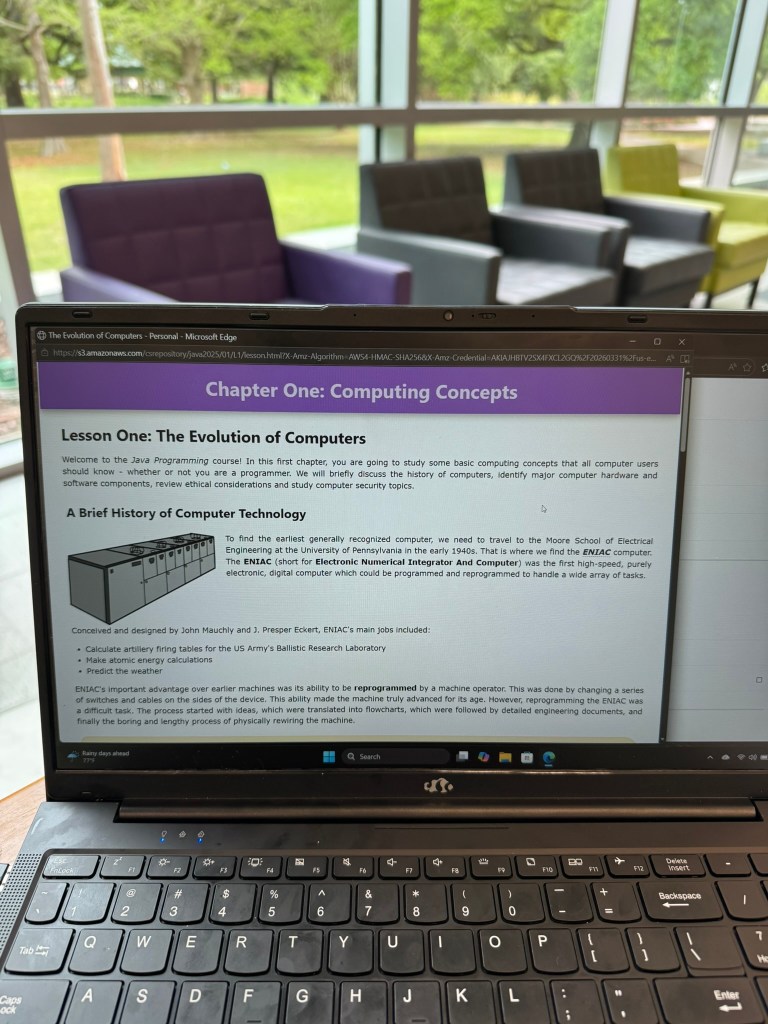 homeschool student working through Java programming lessons on laptop
