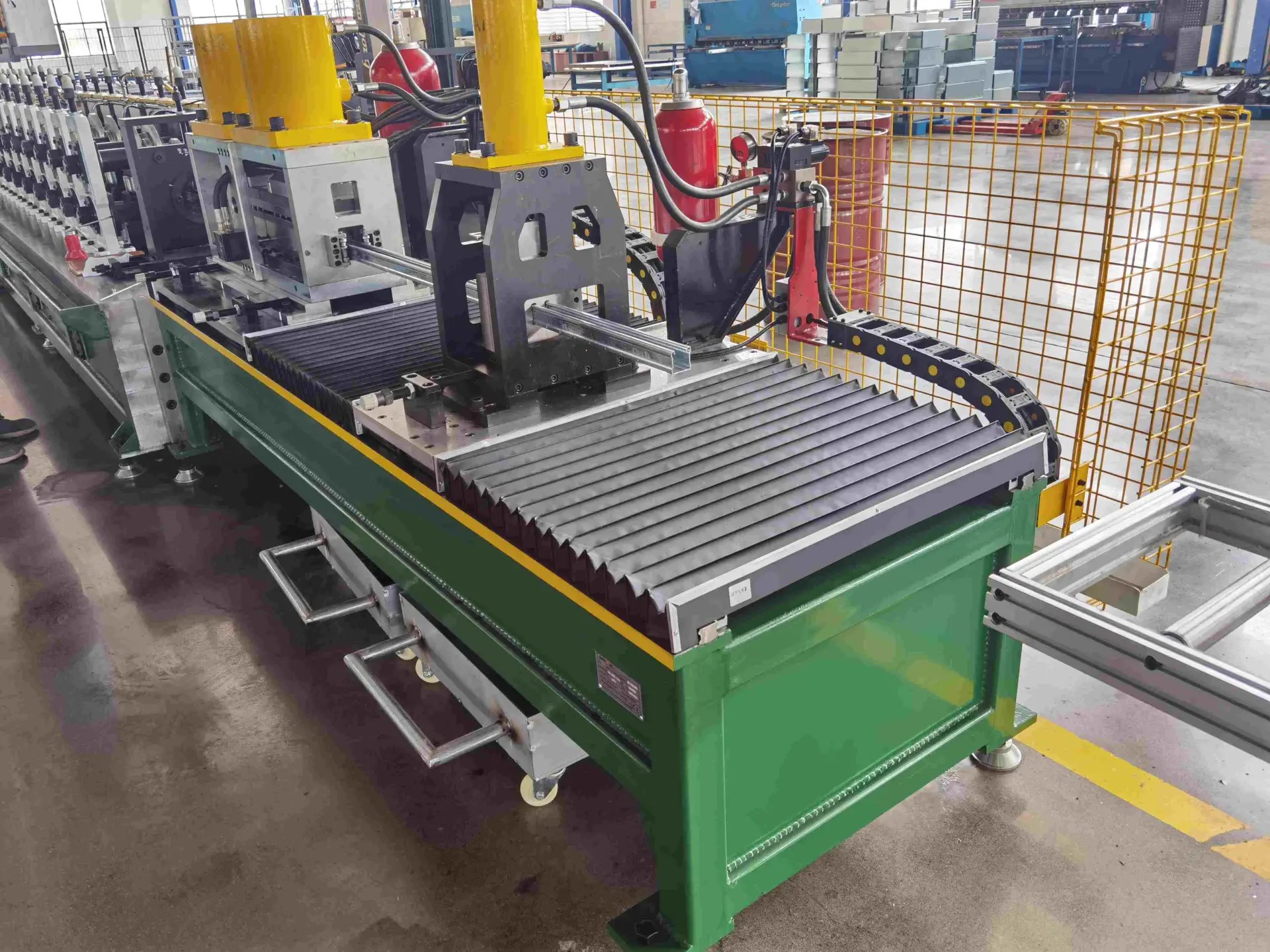 High-speed flying hydraulic cutting system on a medium speed strut channel roll forming machine.