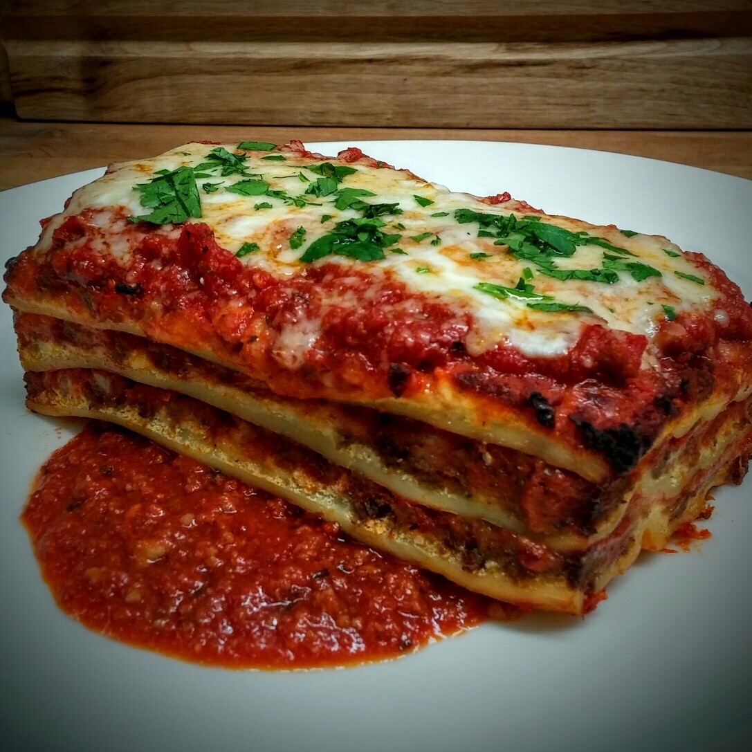 LASAGNA - House Made pasta sheets with spiced ground sirloin Italian sausage, ricotta, Asiago, and mozzarella cheeses