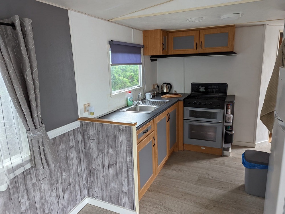 An image of a kitchen in a mobile home for sale on Camping almafra Campsite