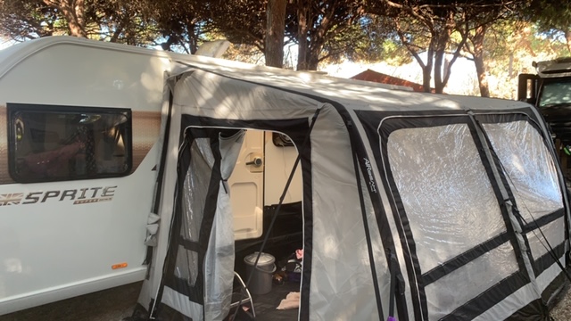 An image of a touring caravan and awning for sale in Spain
