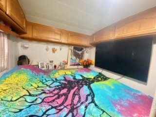 An image of a double bed in a Tabbert caravan being sold on Camping Armanello Campsite in Benidorm, Costa Blanca, Spain
