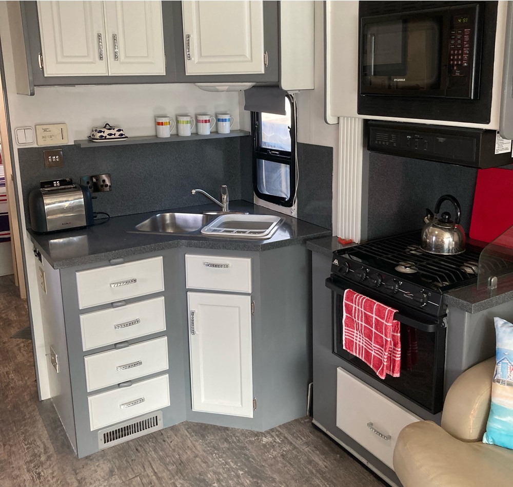 A kitchen in a motorhome for sale in Spain