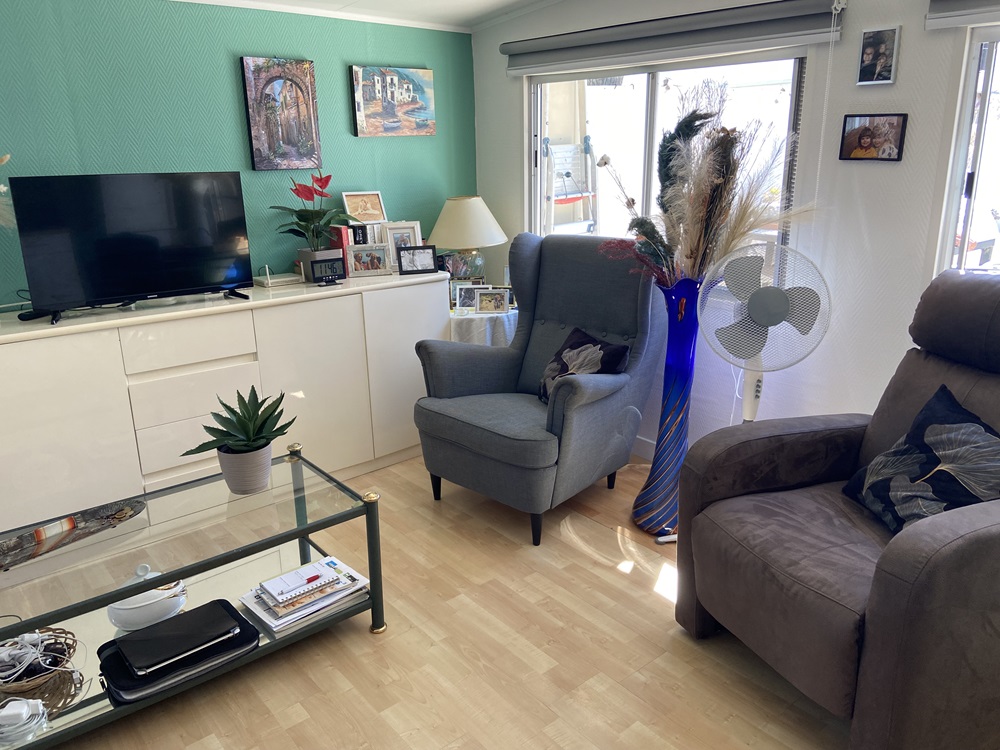 A living room in a caravan being sold on Camping Villasol Campsite in Benidorm