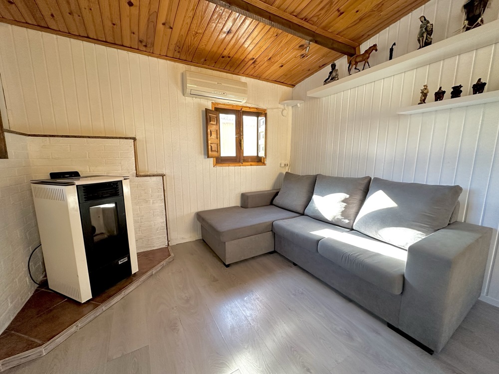 A sofa in a wooden lodge for sale in Totana, Costa Calida, Spain
