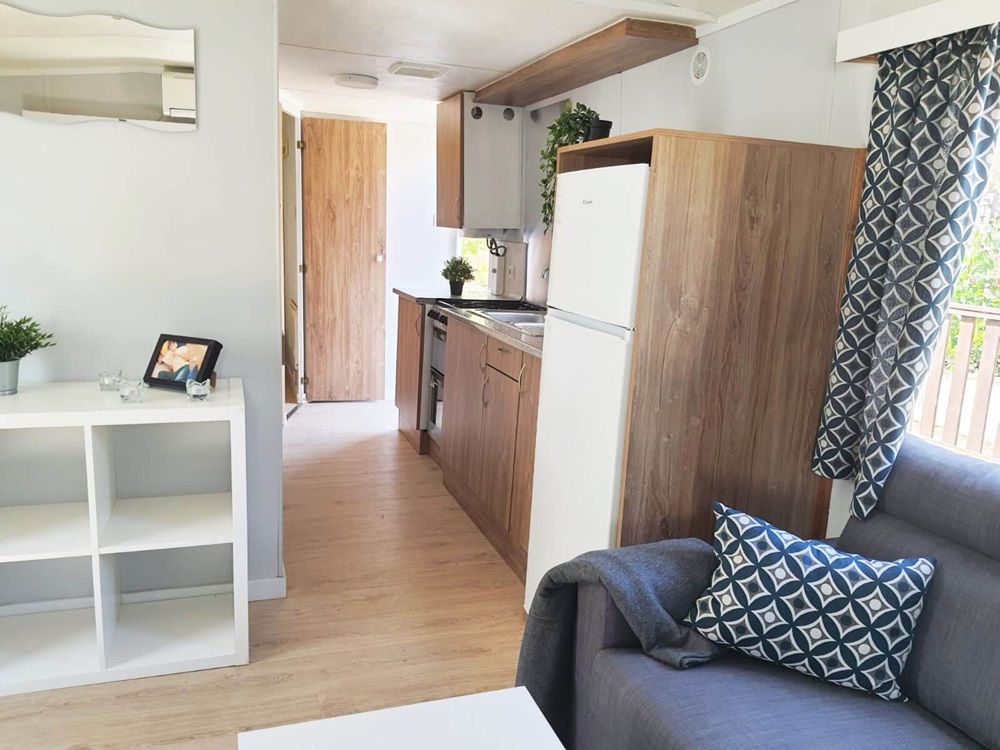 A spacious living room in an Atlas Mirage mobile home