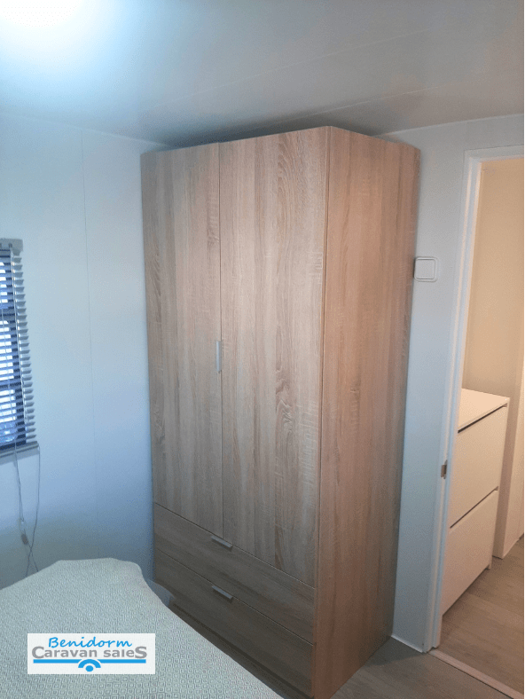 A bedroom in a refurbished RV on Camping Raco Campsite in Benidorm