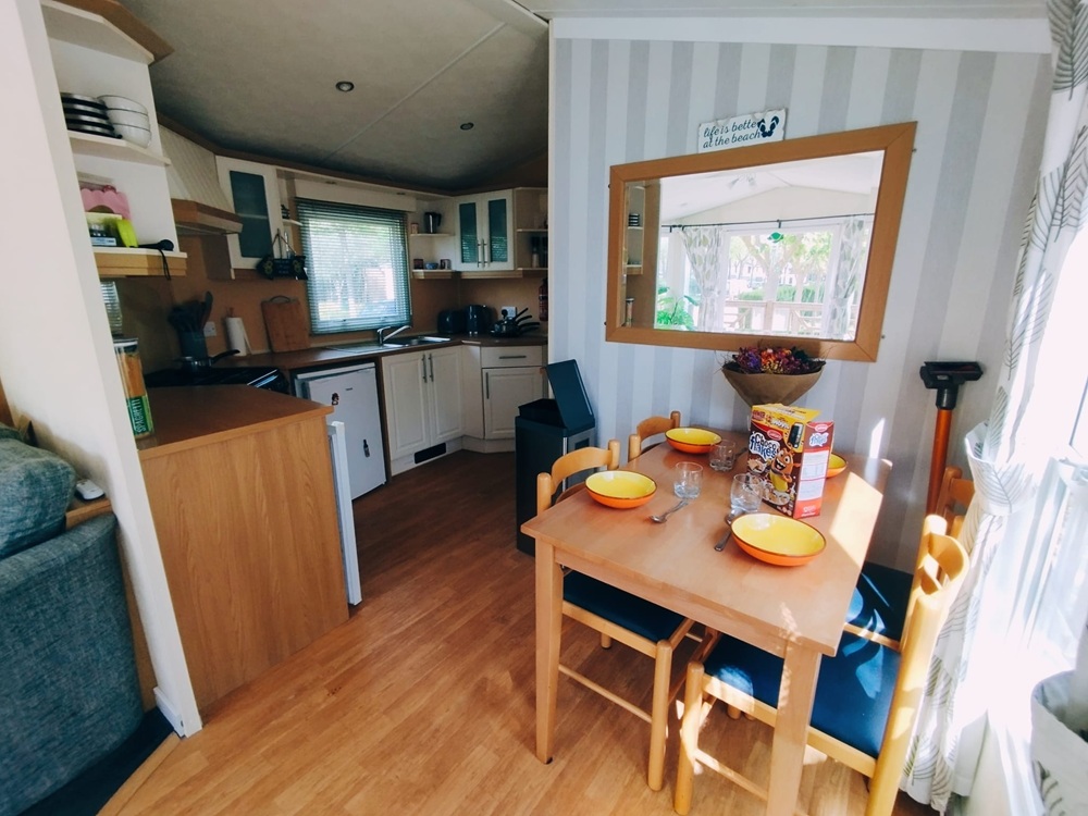 a dining room in a mobile home being sold in Spain
