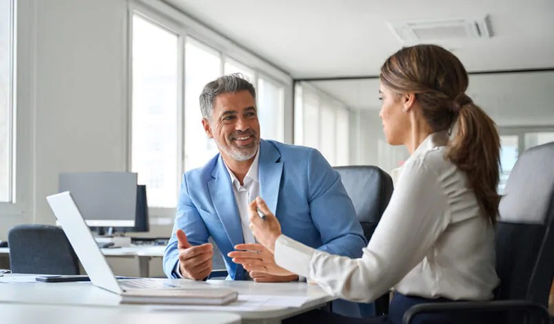 Two older executives team business people man and woman working at office corporate meeting. Happy mature business woman professional bank manager lawyer consulting client on finances management