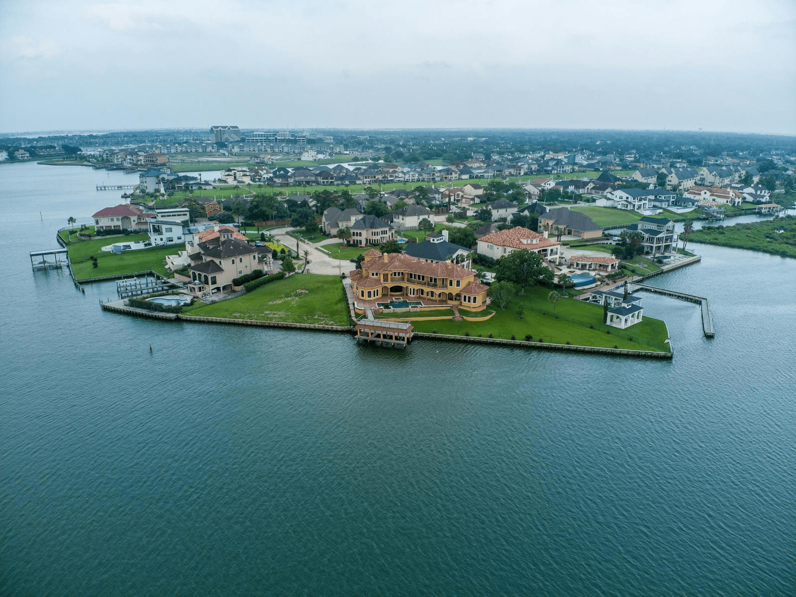 Stunning aerial shot of luxury homes by the water in Houston, Texas.