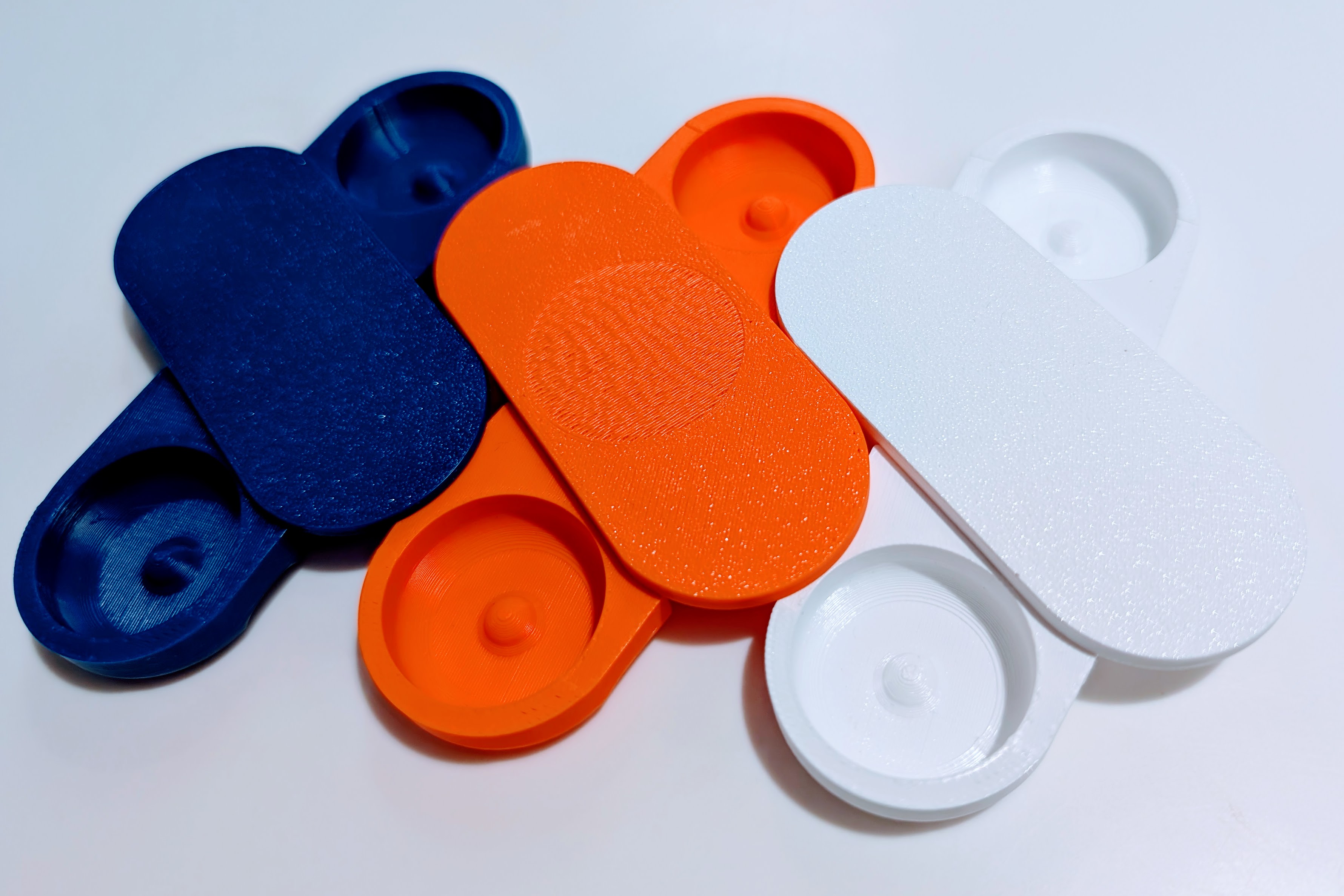 Multi-colored 3D Printed Better Lens Case Prototypes