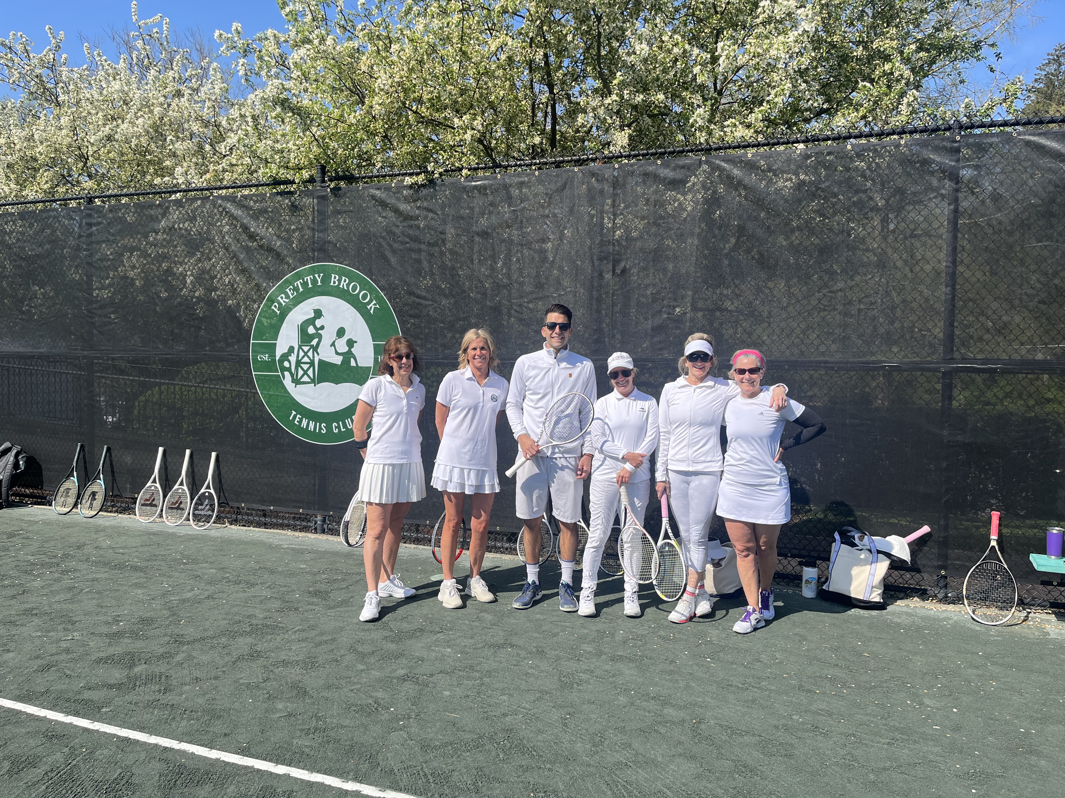 tennis director with students