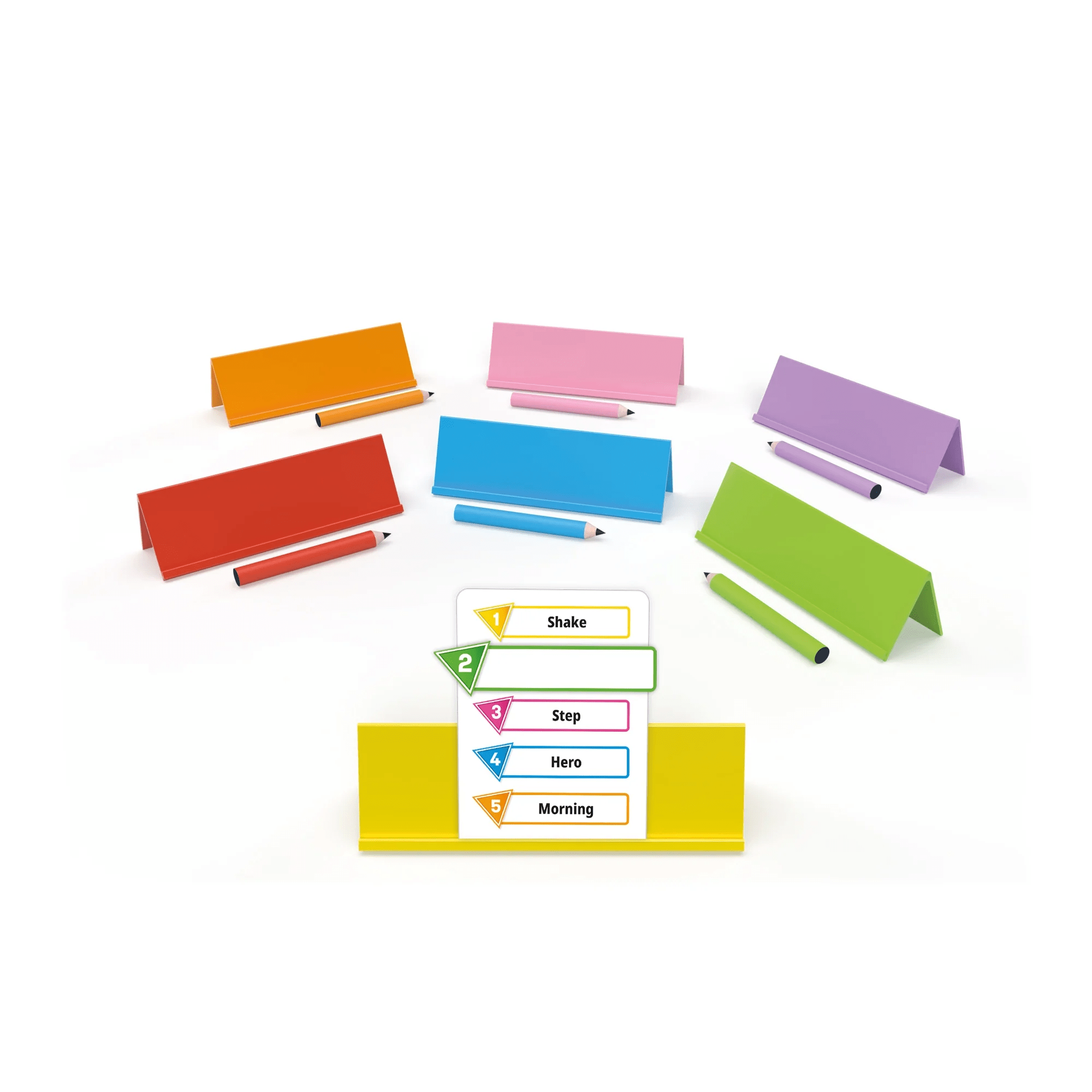 Components of Just One board game displayed on a wooden table, including the game box, word cards, easel, and colorful dry-erase markers.