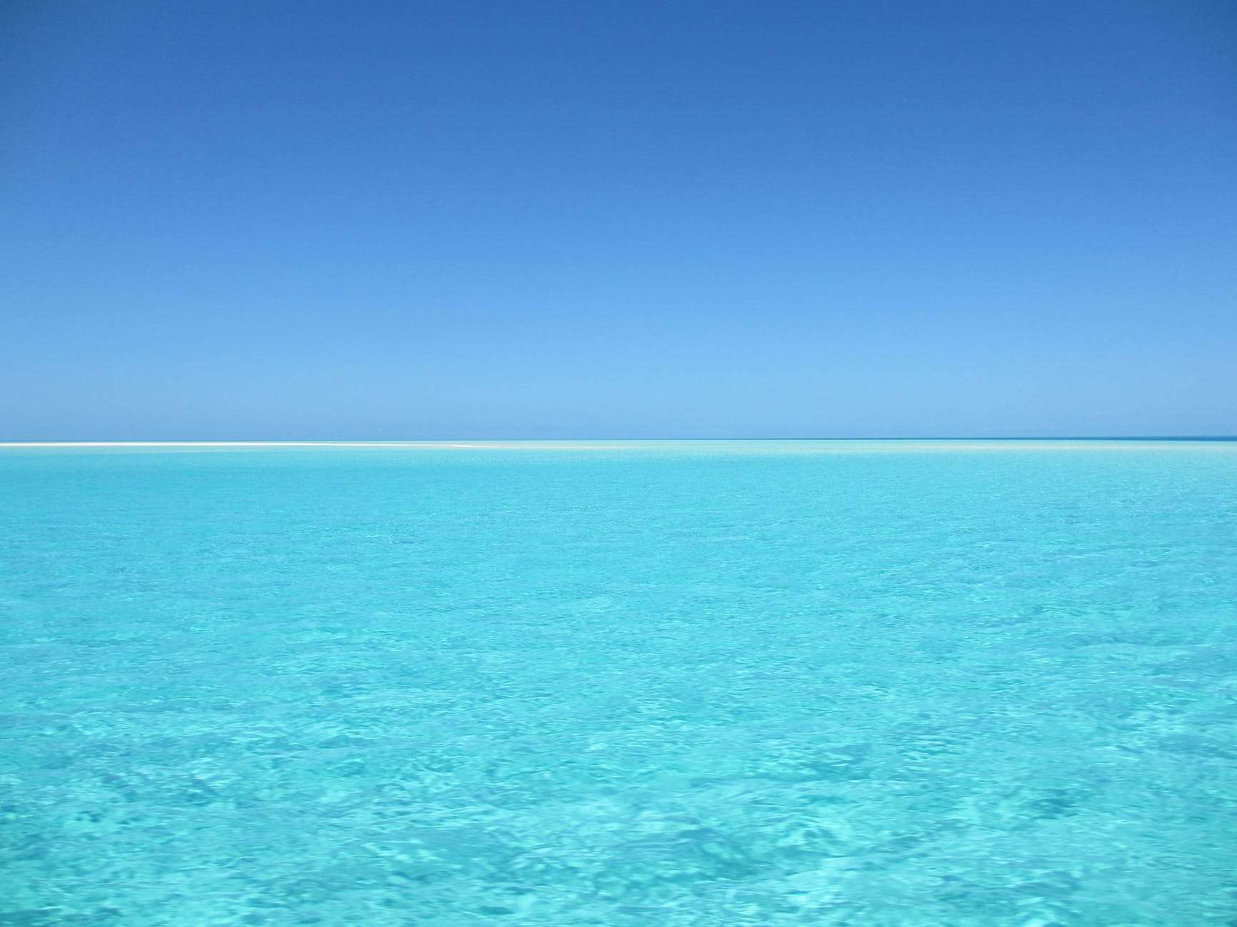 blue and white ocean during day time