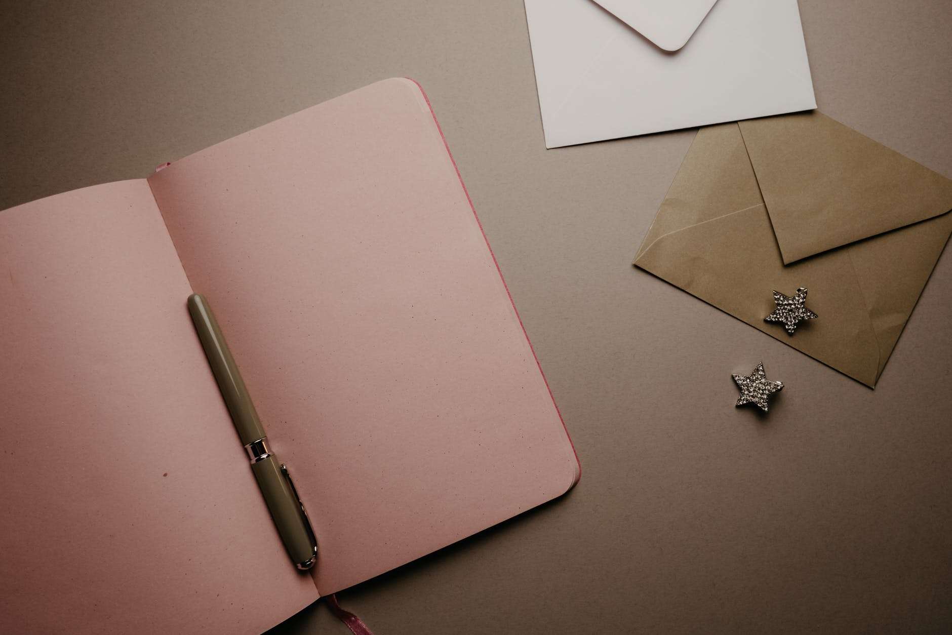 pink notebook on the table