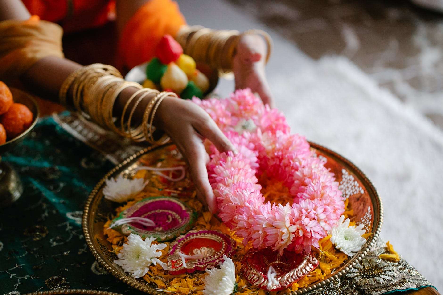 woman creating a flower arrangement for a celebration