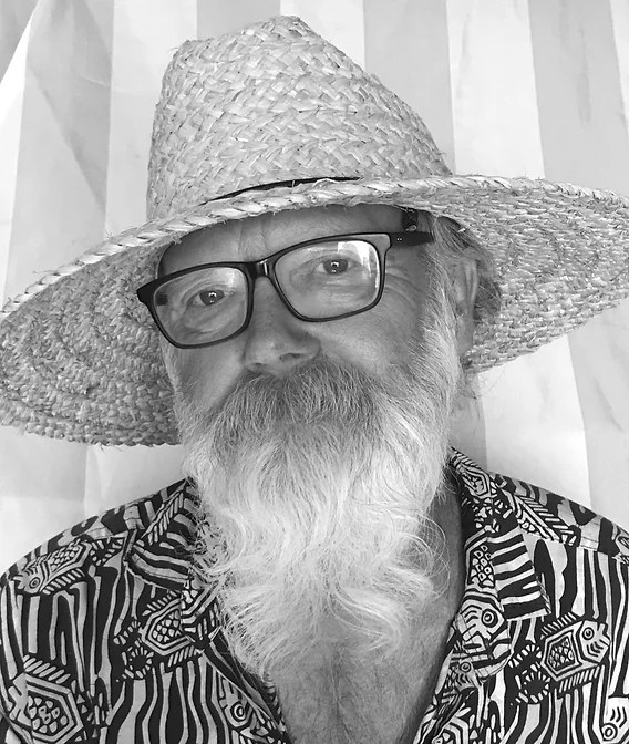 Portrait of older, bearded gentleman in straw hat