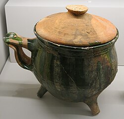 an earthenwear cooking pot with a lid