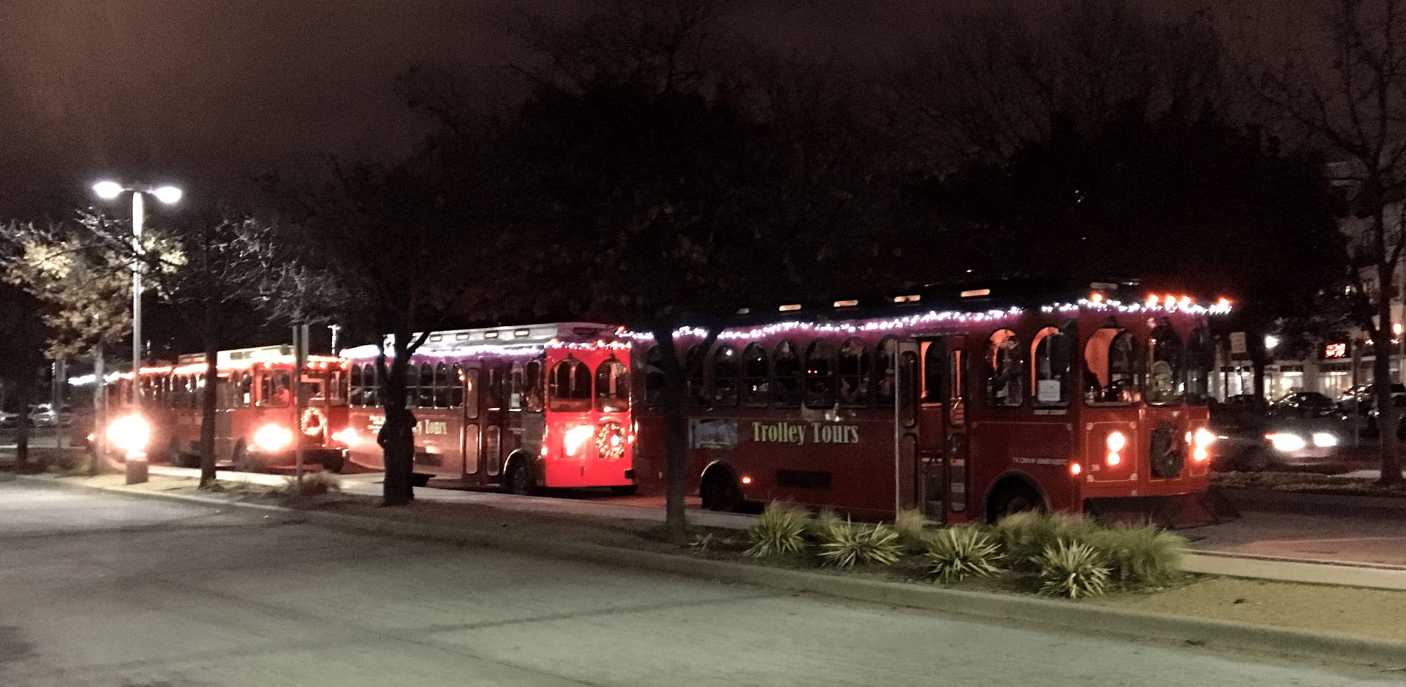 From a trolley tour through the nighttime streets of . Holiday Lights Trolley Ride Big D Fun Tours