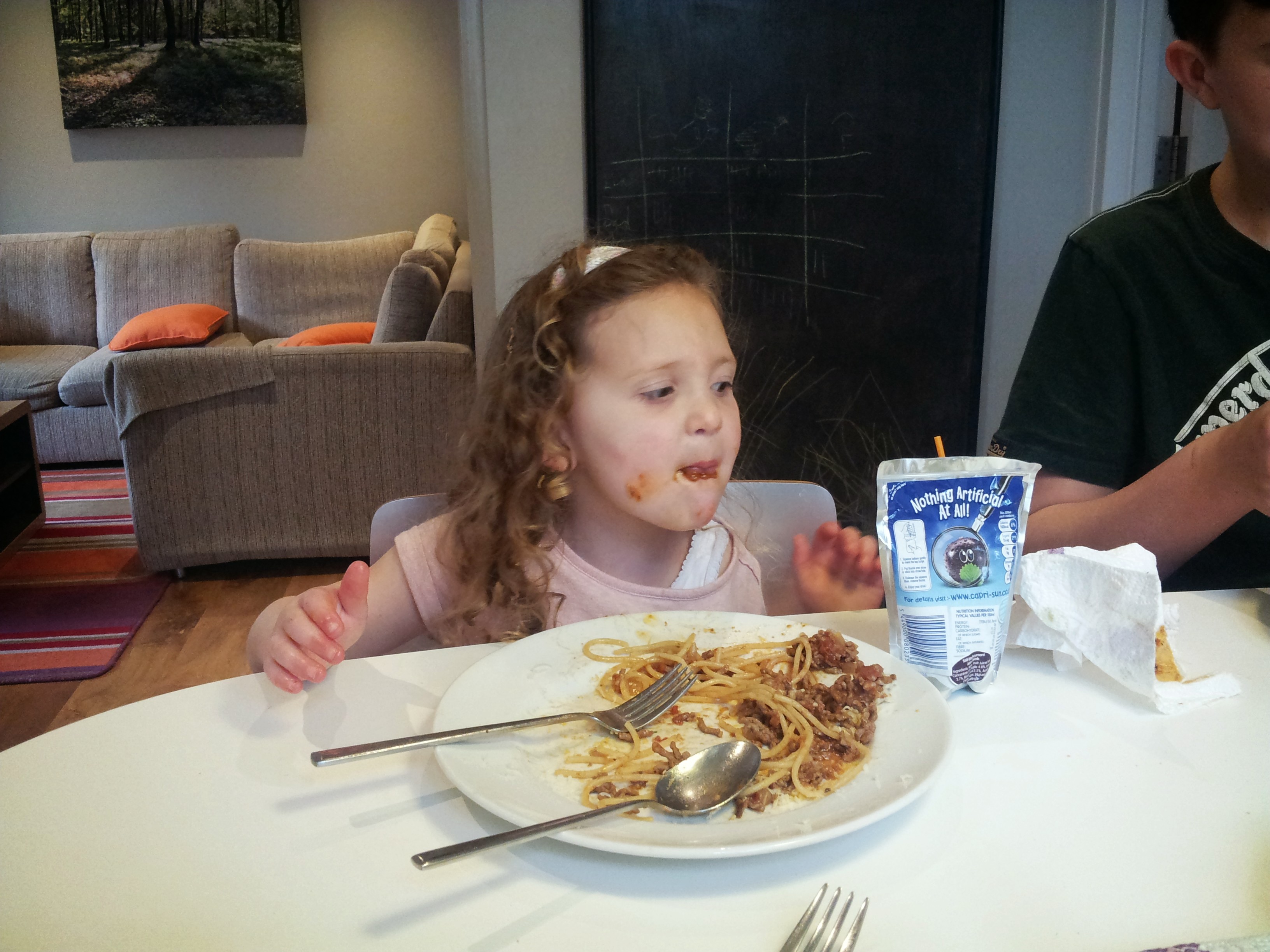 enjoying spaghetti bolognese