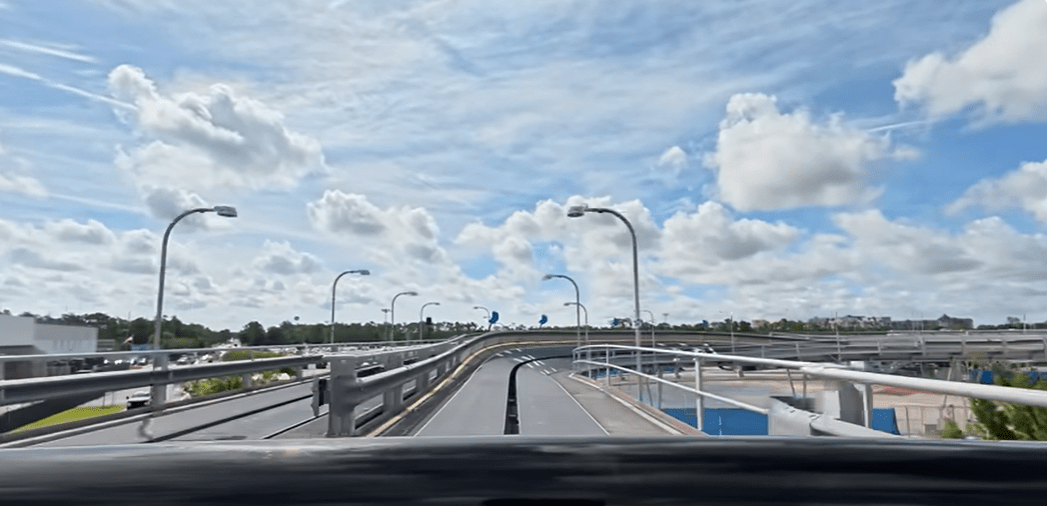 pov of outside portion of test track ride facing the track and sky