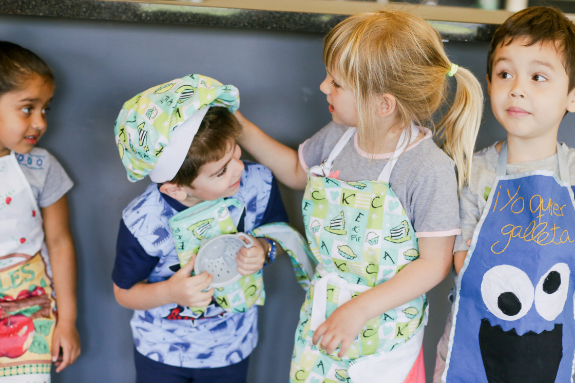 We offer Spanish immersion elective classes like art, cooking (pictured), dance, music, and more