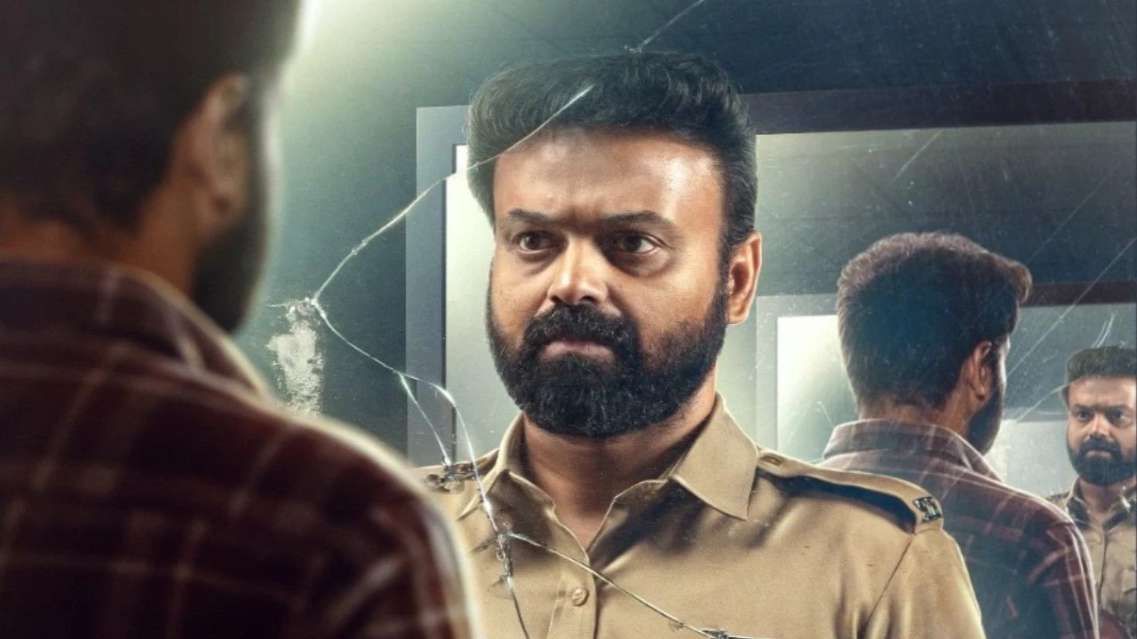 Kunchacko Boban as Shelly facing his fractured reflection in Unmadham