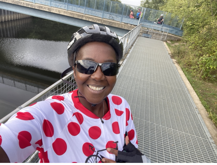 Woman in spotty cycling top.