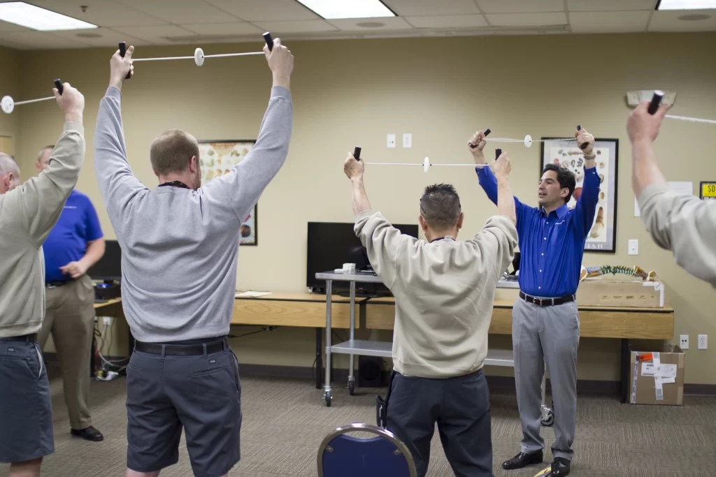 BIOKINETIX employees showing workers how to stretch