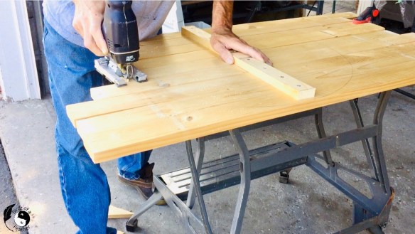 Cutting the pallet wood with a jigsaw for Wooden Wall Art DIY