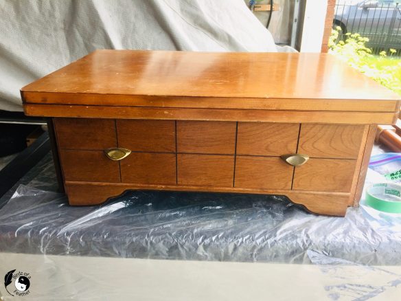 MCM sewing table being disassembled for how to clean brass hardware