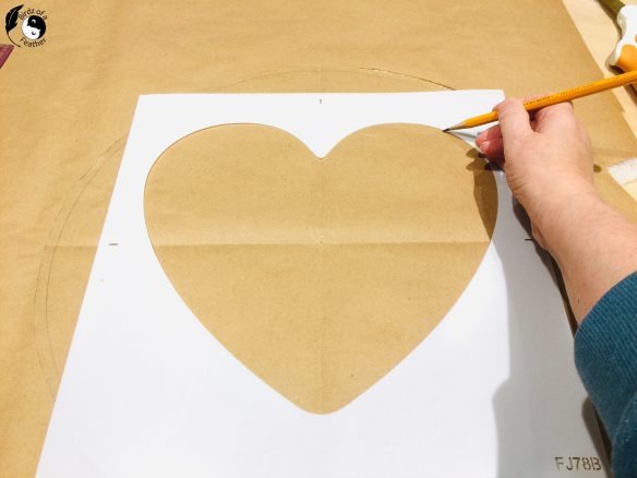 Tracing a heart stencil to use for felt appliqué pattern