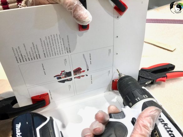 Cordless drill drilling into upcycled book