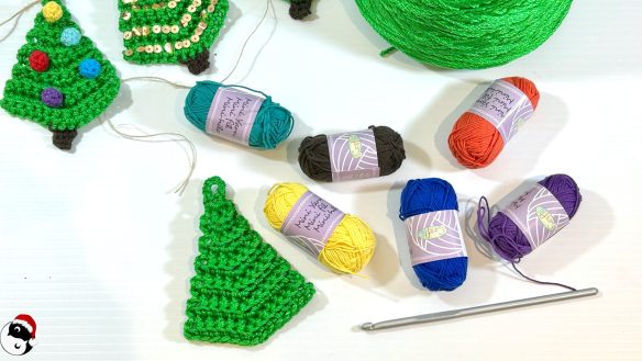 Mini yarns and crochet hook, plus plain and finished Crochet Christmas Trees