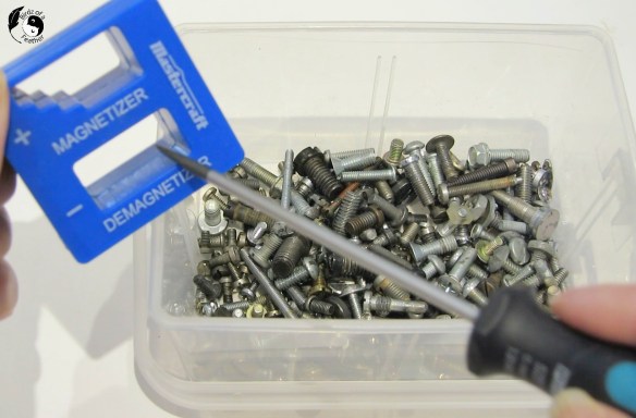 Screwdriver being run through the degmagnetizer section of the tool