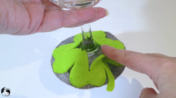 Putting on the slip on coaster to wine base of wine glass