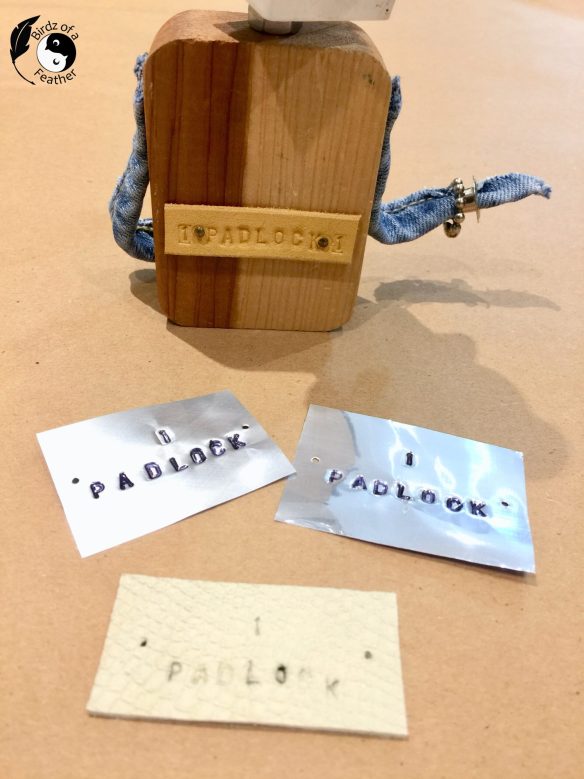 Materials like leather and tin stamped with the name Padlock