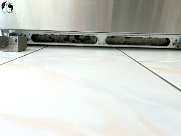 Dust underneath the front of fridge